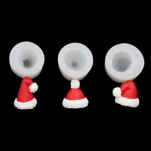 3D Santa hat silicone molds with red resin finished products on black background