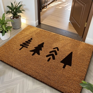 Detail of durable brown coconut fiber doormat featuring four black pine tree patterns