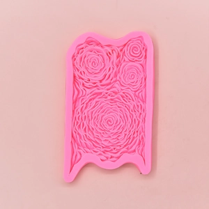 Pink silicone mold featuring detailed rose textures for DIY fondant cake baking and crafts