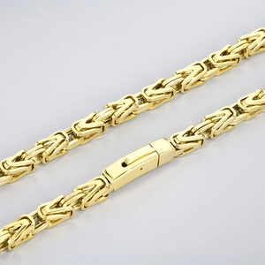 Detailed macro view of the gold Byzantine chain link texture and sturdy rectangular clasp