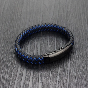 Detail of blue and black woven leather bracelet with matte black magnetic buckle