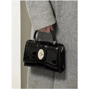 Glossy black patent leather handbag with chain strap and silver buckle for women