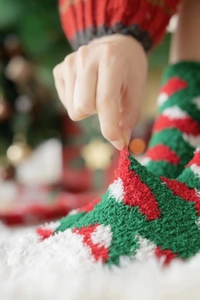 Close-up of soft coral fleece Christmas socks showing the thick fluffy texture