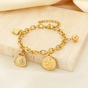 Detailed view of 18K gold plated stainless steel bracelet with butterfly and heart charms