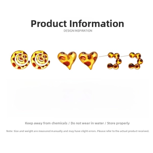 Detailed view of leopard print resin earrings in heart, spiral, and C-shape designs