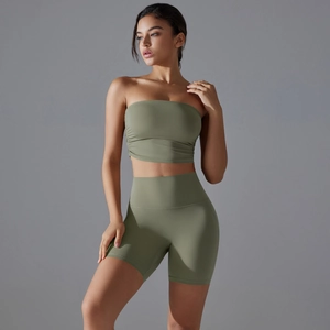 Detail of high-waisted olive green fitness shorts and strapless top set for yoga sports