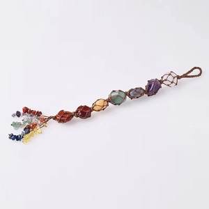 Detailed view of handmade Seven Chakra natural stone car hanging with woven tree of life
