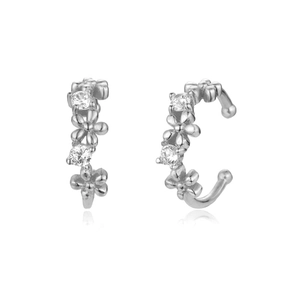 Detailed macro of silver flower ear cuffs set with sparkling cubic zirconia crystals