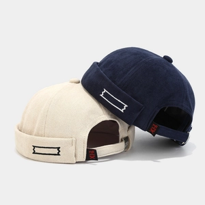 Retro velvet docker hats in beige and navy blue with side embroidery and adjustable strap