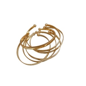 Set of six golden metal open bangles with embossed textures and bead details for women
