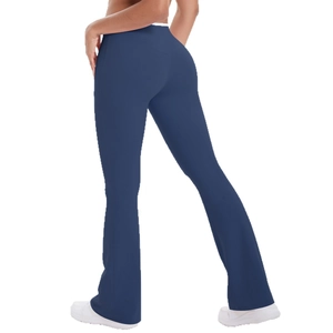 Deep blue high-waisted flared yoga pants with elastic matte fabric shown from back view