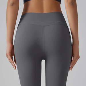 Macro view of high-waist yoga pants with curved stitching for a peach butt lift effect
