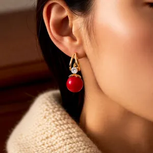 Vintage zircon resin round pendant earrings in gold finish on female model profile