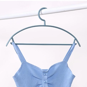 Nonslip semi-circle wide shoulder hanger for clothes with a blue knitted camisole