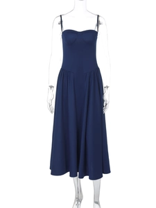 Detail of dark blue backless midi dress with supportive bust design and thin straps