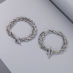 Detail of silver stainless steel Miami Cuban link bracelet with stylish OT toggle clasp