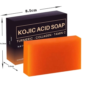 Detail view of Kojic Acid soap bar with packaging showing turmeric and vitamin C