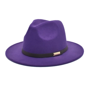 Detail of dark purple wool fedora hat featuring black leather band and gold buckle