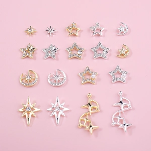 Star and moon nail art charms in gold and silver finish with rhinestones and pearls