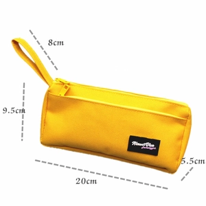 Detail view of yellow canvas stationery bag with Almost Blue label and dimensions