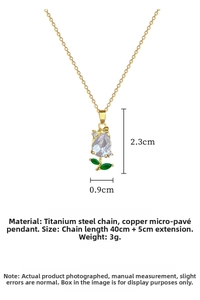Close-up of tulip pendant with zircon petals and green leaves on gold titanium chain