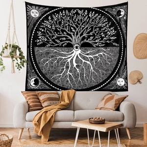 Detail of life tree tapestry featuring mystical eye patterns in a cozy living room setting