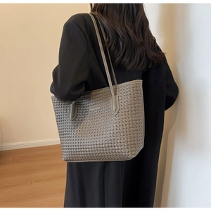 Detail of grey woven texture PU leather tote bag with long shoulder strap