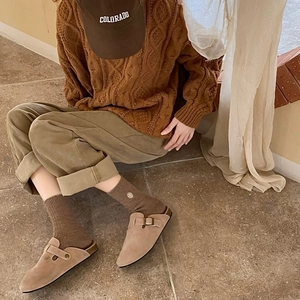 Winter thermal socks for women worn with beige suede mules and khaki corduroy pants