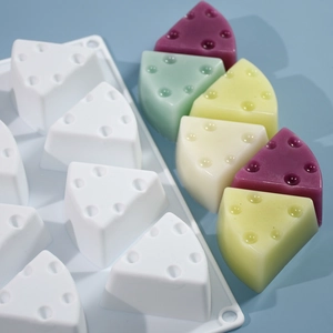 Detail view of 8-cavity triangle cheese silicone mold with realistic resin craft results