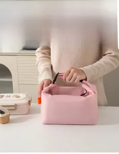 Pink dumpling lunch bag with reinforced handle and secure plastic buckle detail