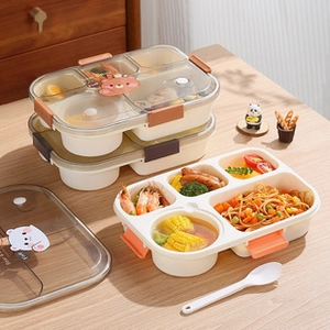 Detailed view of 5-compartment stainless steel bento box with orange clips on wood table