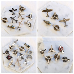 Retro metal aircraft engine and propeller brooches in assorted vintage plating finishes