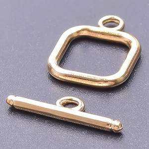 Close-up of golden 18k vacuum plated stainless steel OT toggle clasp for DIY jewelry