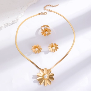 Golden daisy jewelry set with pearl centers including necklace, earrings and ring