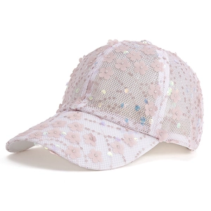 Detail of pink mesh baseball cap featuring 3D fabric flowers and iridescent sequins