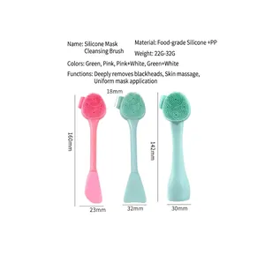 Double-ended silicone facial cleansing brush and mask applicator in pink and green