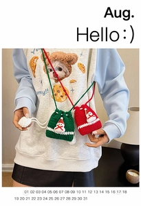Detail of handmade crochet Christmas reindeer bag with snowman pattern and drawstring