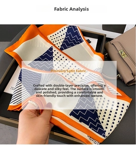 Detail of silk-like neck scarf with geometric patterns on a luxury leather handbag