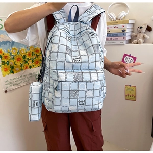 Detail of light blue plaid backpack set with cute rabbit graphic and matching pencil case