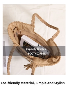 Detail shot of the spacious interior with beige lining and smooth zipper on straw bag