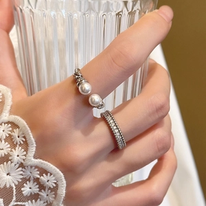 Elegant zircon texture pearl open ring set worn by model for high-end fashion styling