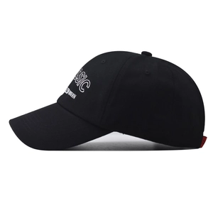 Close-up of the CLASSIC and STYLISH MODERN embroidery on black cotton baseball cap