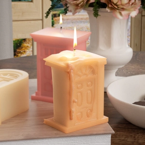 Macro detail of Roman palace gate scented candle with textured archway and warm glow