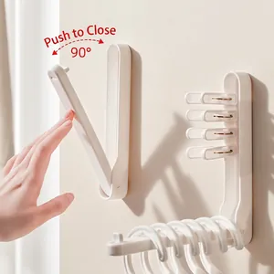 Space-saving wall-mounted folding clothes drying rack with 90-degree rotating support arm