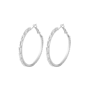 Detail of silver hoop earrings with rectangular clear cubic zirconia in a pave setting