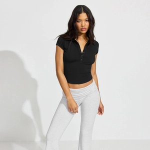 Slim fit polo crop top and grey leggings set highlighting the ribbed cotton fabric detail