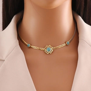 Turquoise flower pendant necklace in gold stainless steel on a professional model