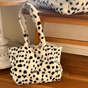 Fuzzy cow print plush tote bag with handmade metal tag for autumn and winter fashion