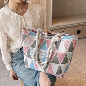 Canvas tote bag with geometric print and thick rope handles for beach or casual use
