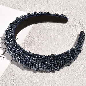 Close-up of luxury dark blue beaded headband with faceted crystals and sponge padding